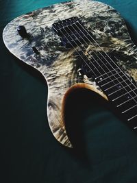 High angle view of guitar on table