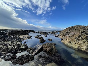 Scenic view of rocks against sky during winter