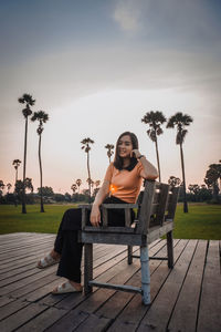 Young woman sitting on bench