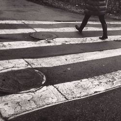 Low section of people walking on road