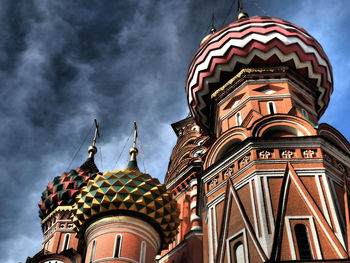 Low angle view of building against cloudy sky