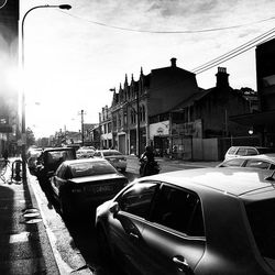 Cars on road at sunset