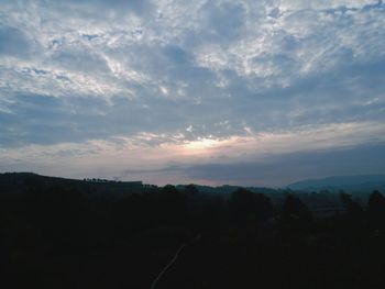 Scenic view of silhouette landscape against sky during sunset