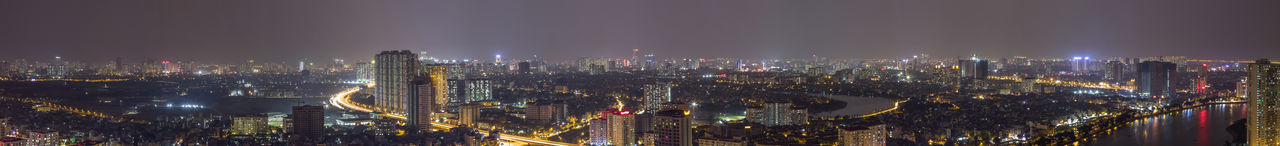 High angle view of city lit up at night