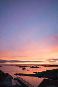 Scenic view of sea against romantic sky at sunset