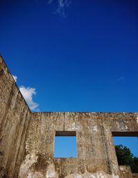 Low angle view of building against blue sky