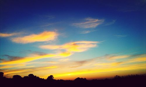 Low angle view of dramatic sky during sunset