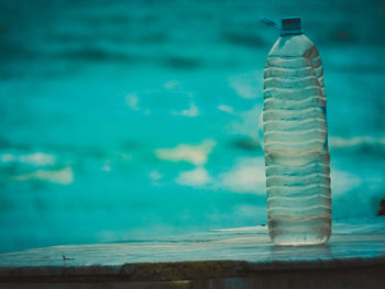 Close-up of glass bottle on table