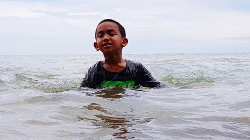 Portrait of man on beach against sky