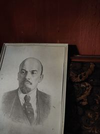 Portrait of young man against wall