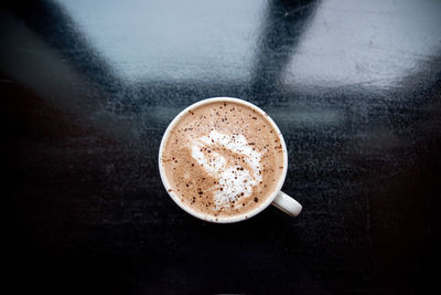 Close-up of coffee cup on table