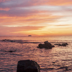 Scenic view of sea against sky during sunset