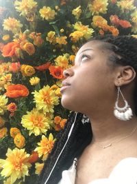 Close-up of young woman with flowers