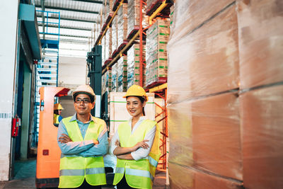 Full length portrait of worker working at construction site