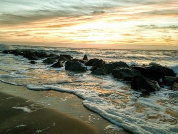 Scenic view of sea against sky during sunset