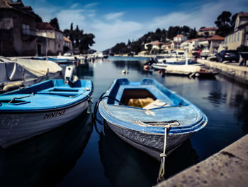 Boats moored at harbor