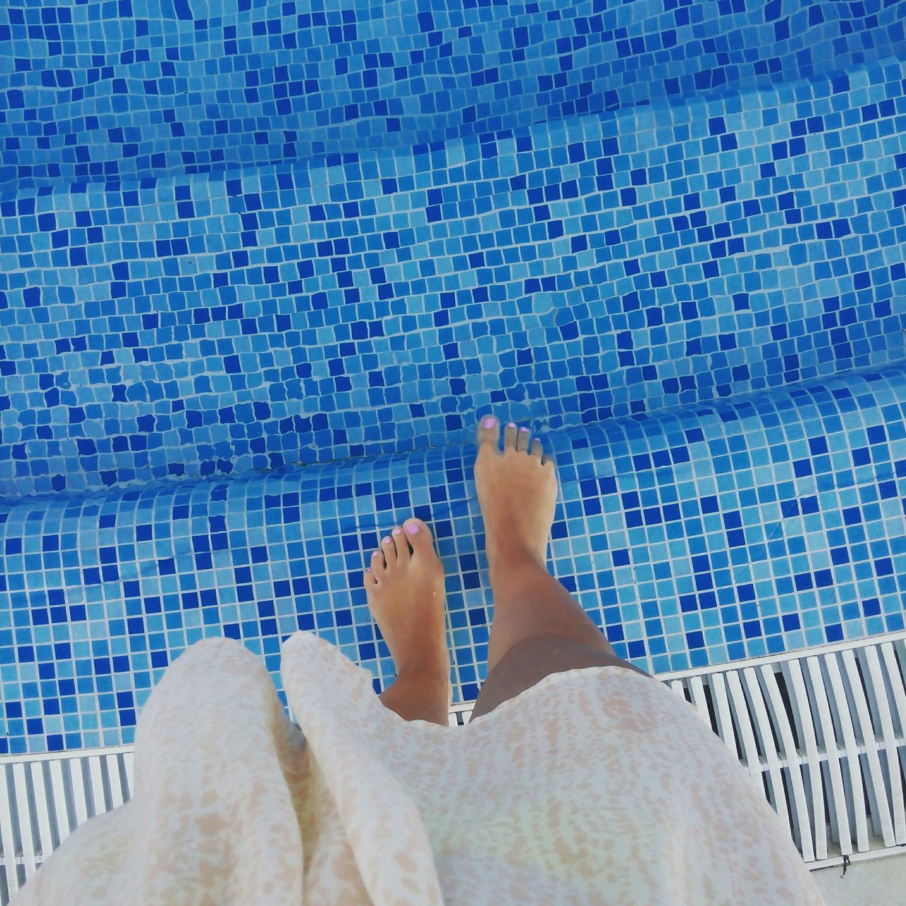 person, low section, personal perspective, indoors, human foot, barefoot, lifestyles, relaxation, leisure activity, high angle view, blue, tiled floor, men, part of, bed, relaxing