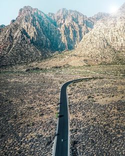 Shadow of car on mountain road