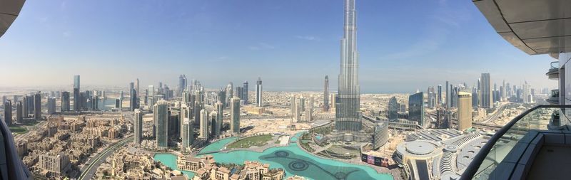 Panoramic view of burj khalifa and cityscape seen through balcony