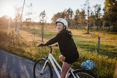 Smiling girl cycling