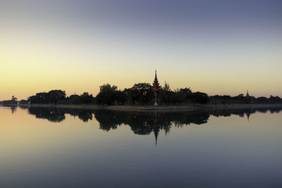 Scenic view of lake against sky during sunset