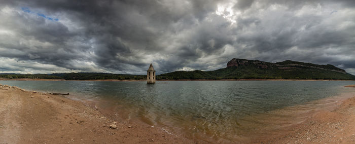 Scenic view of sea against cloudy sky