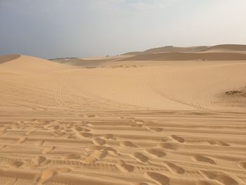 Scenic view of desert against sky