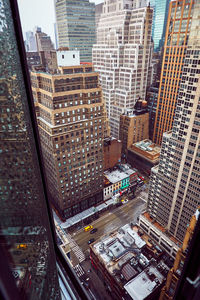 High angle view of street amidst buildings in city