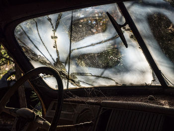 Close-up of abandoned car window