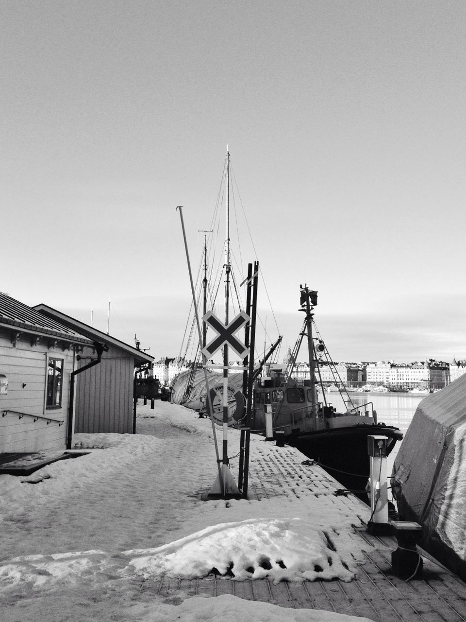 built structure, sea, clear sky, architecture, sky, copy space, fuel and power generation, beach, crane - construction machinery, building exterior, day, outdoors, no people, nature, sand, construction site, industry, environmental conservation, horizon over water, commercial dock