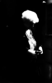 Woman standing at night