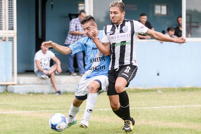 Men running on soccer field