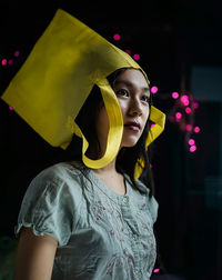 Portrait of a young woman looking away