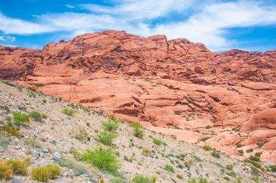 Scenic view of mountain against cloudy sky
