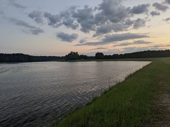 Scenic view of lake against sky during sunset