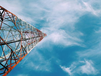 Low angle view of communications tower against sky