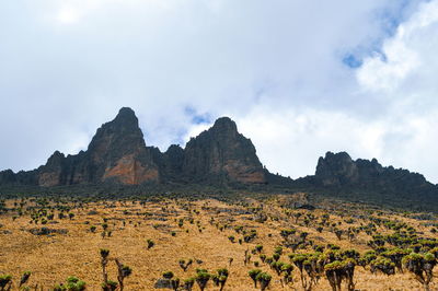 Volcanic rock formations against a blue sky, mount kenya national park, kenya