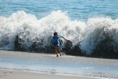 People surfing in sea