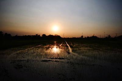 Scenic view of sunset over land