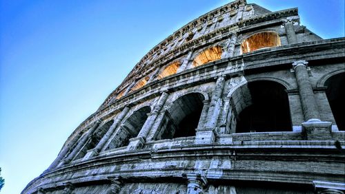 Low angle view of amphitheater against clear sky