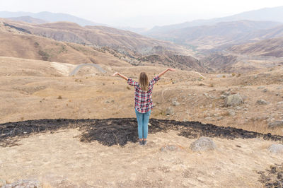 Woman standing in mountains