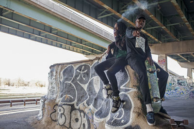 Two young men at a skateboard park.