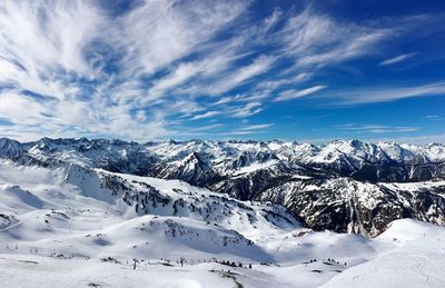 Scenic view of snowcapped mountains against sky