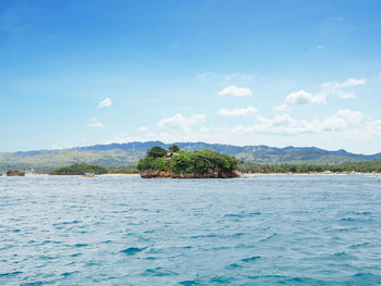 Scenic view of sea against blue sky