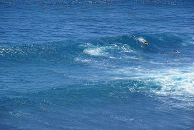 Scenic view of sea against blue sky