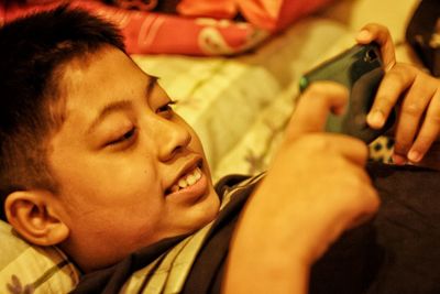 Close-up of young man using mobile phone