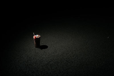 High angle view of fire hydrant against black background