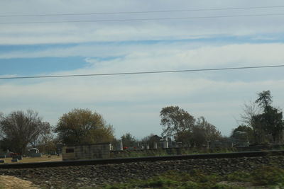 Scenic view of trees against sky