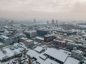 High angle view of city against sky during winter
