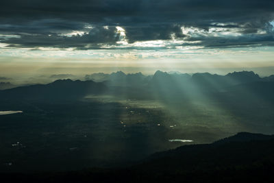 Scenic view of silhouette mountains against sky at sunset